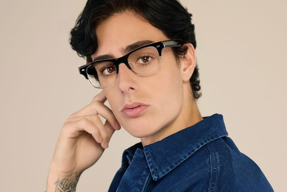 Model wearing Kristof frame made of acetate material.