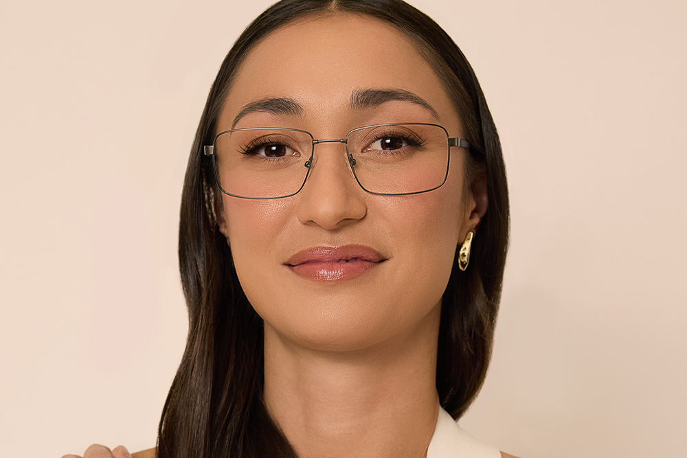 Keizel eyeglasses frame worn by model.